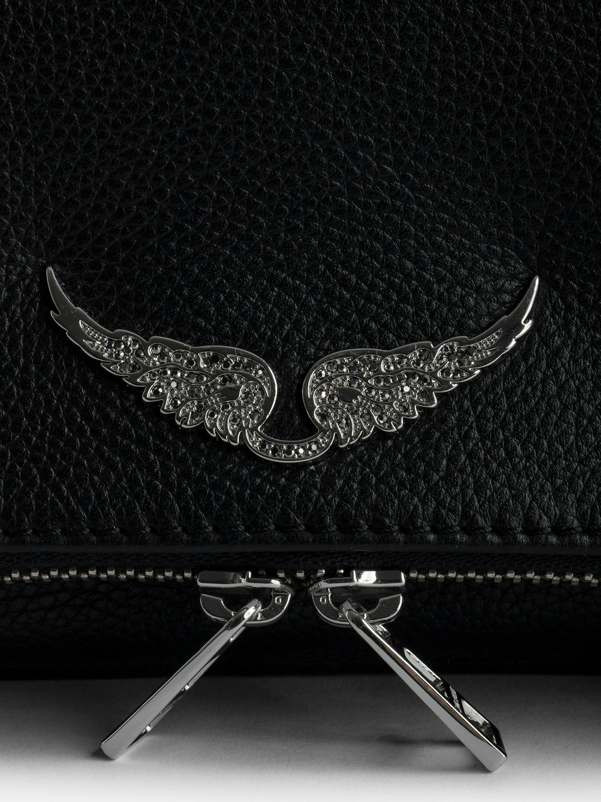 Rock Clutch - The iconic Rock women's leather clutch will take you seamlessly from day to evening.
It features a double chain and leather strap, so you can choose to wear it across the body or on the shoulder.